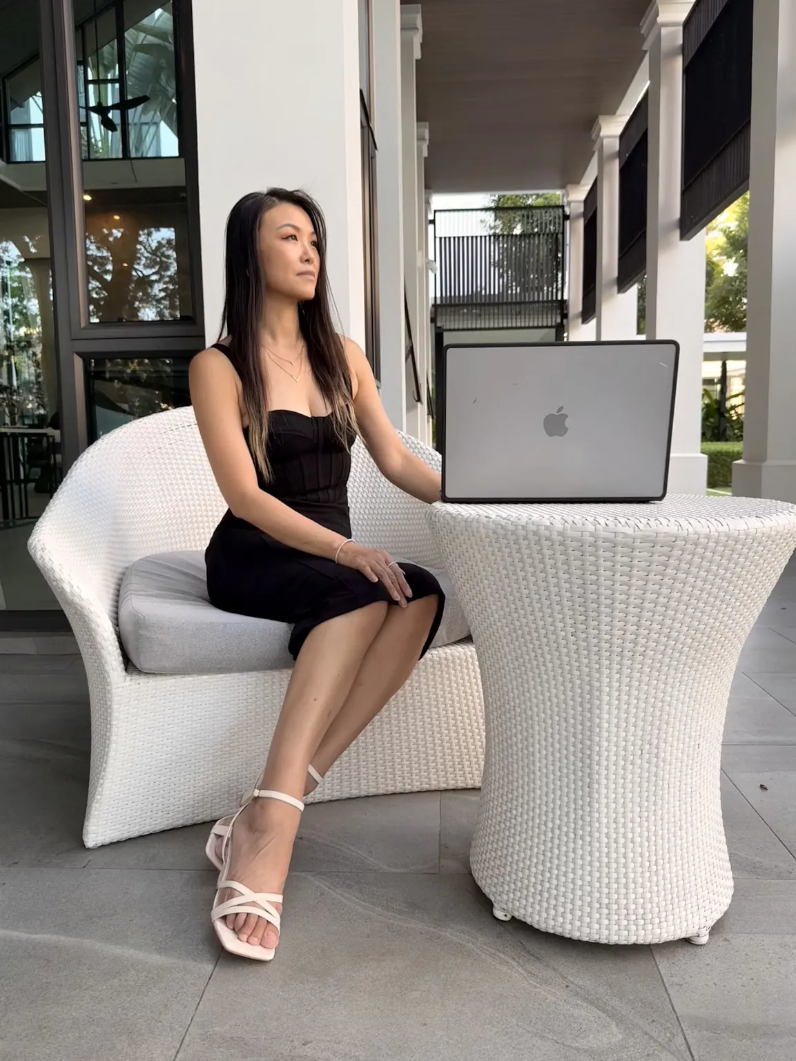 Alice Muse seated beside her laptop